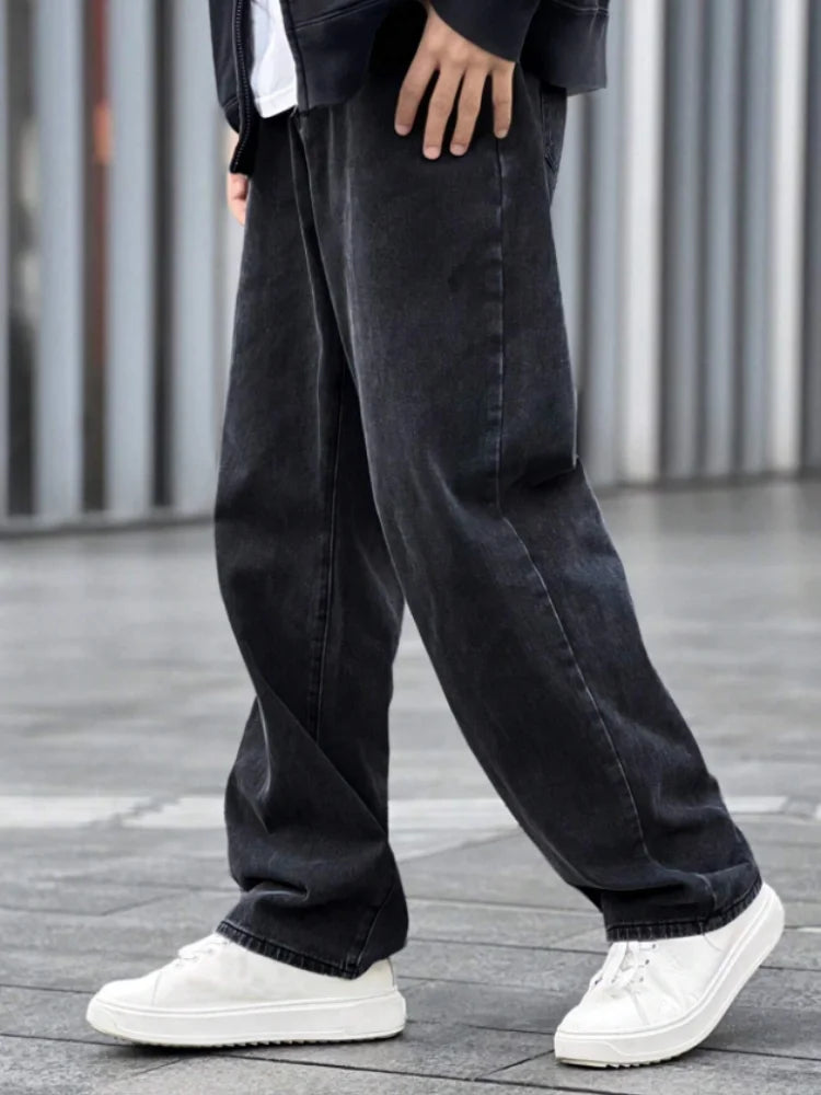 A top choice for autumn and winter transitions! Loose black men's jeans with inherent warmth, comfortable and versatile, suitabl