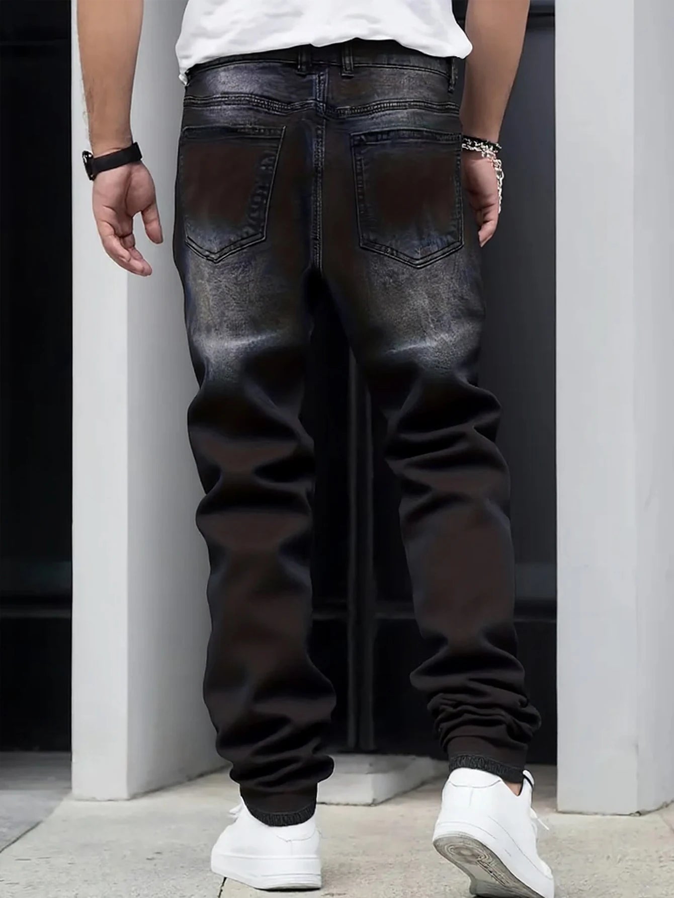 Men's black and gray distressed jeans, featuring a unique worn-out design, loose fit, and versatile style, effortlessly creating