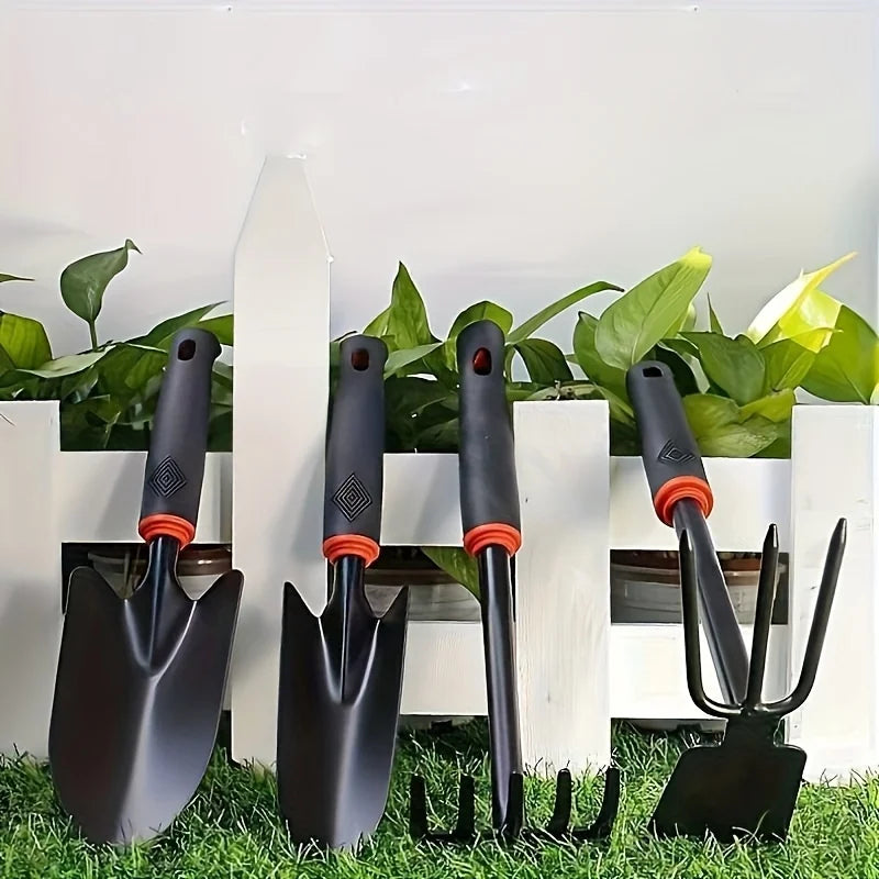A Set of Four Outdoor Gardening Tools Including a Small Shovel for Planting Flowers, a Five-Pronged Rake, a Double-Headed Rake