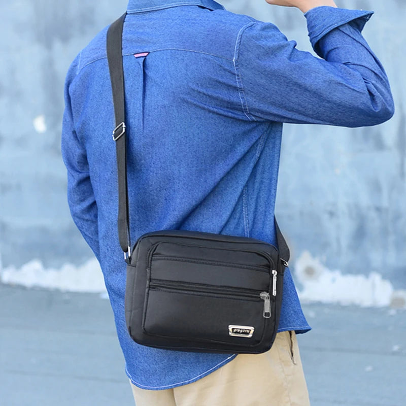 Men's business bag with double pockets, can be worn crossbody or over the shoulder, suitable for business trips.