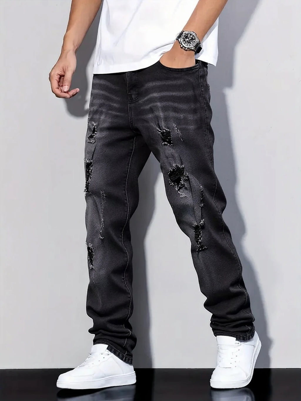 Men's black and gray distressed jeans, featuring a unique worn-out design, loose fit, and versatile style, effortlessly creating