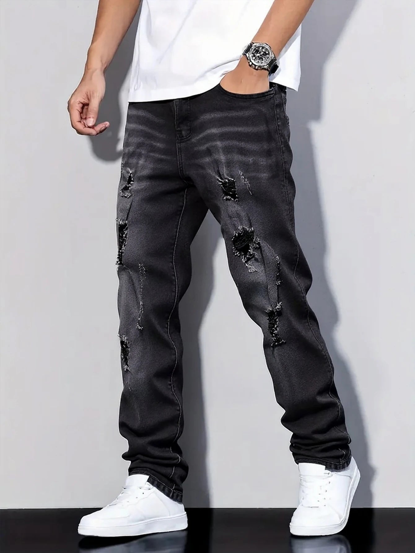 Men's black and gray distressed jeans, featuring a unique worn-out design, loose fit, and versatile style, effortlessly creating