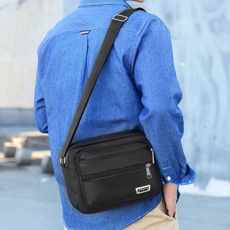 Men's business bag with double pockets, can be worn crossbody or over the shoulder, suitable for business trips.