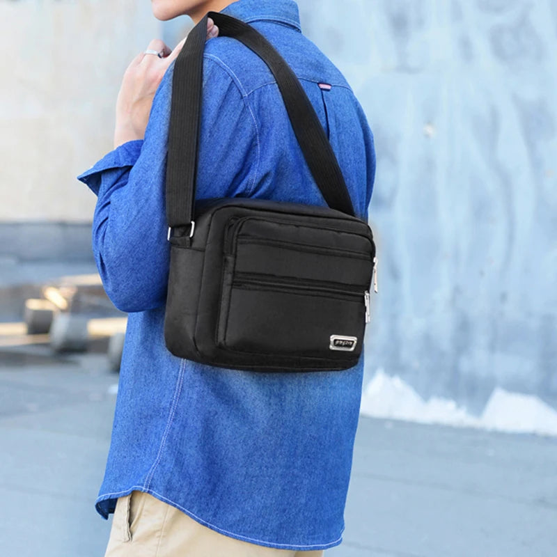 Men's business bag with double pockets, can be worn crossbody or over the shoulder, suitable for business trips.